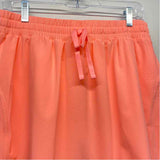 Beyond Yoga Size L-12 Women's Peach Solid Pull On Skort