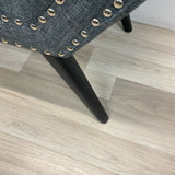 Gray bench silver nailhead trim and black solid wood legs