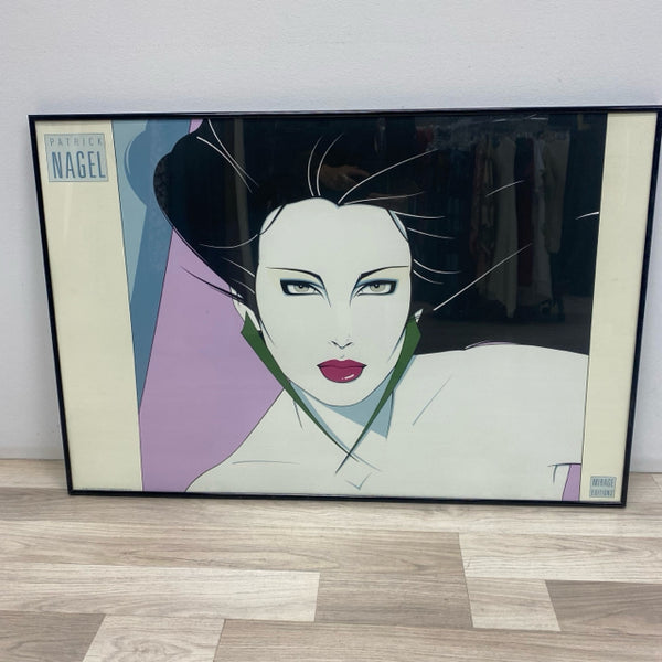 Framed Print of Woman with Long Green Earrings by Patrick Nagel