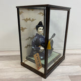 Japanese Doll in a glass case