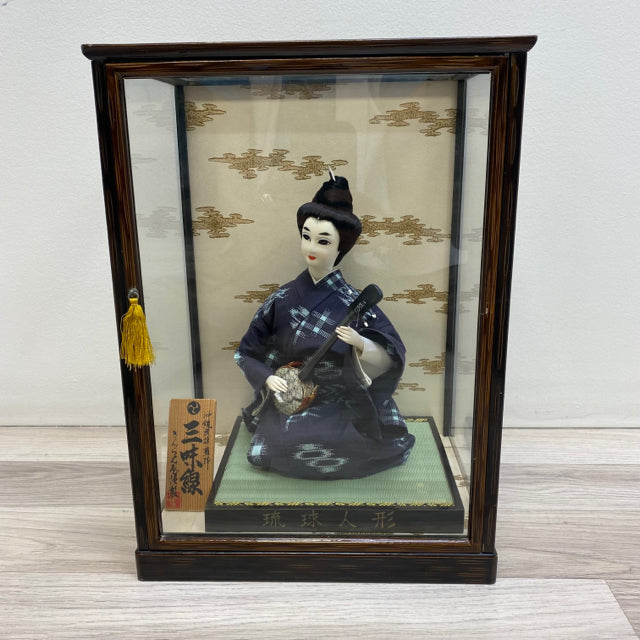 Japanese Doll in a glass case