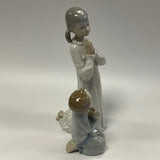 Lladro Figurine #04779 Teaching to Pray - Girl and Boy Praying